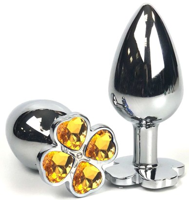 Серебристая анальная втулка с клевером из оранжевых кристаллов - 6 см.