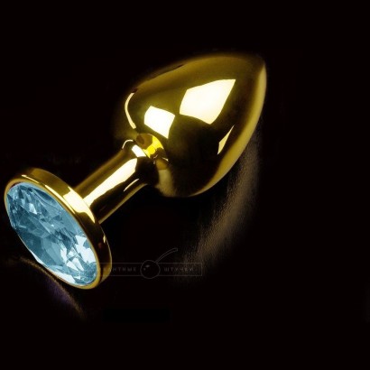 Маленькая золотистая анальная пробка с круглым кончиком и голубым кристаллом - 7 см.